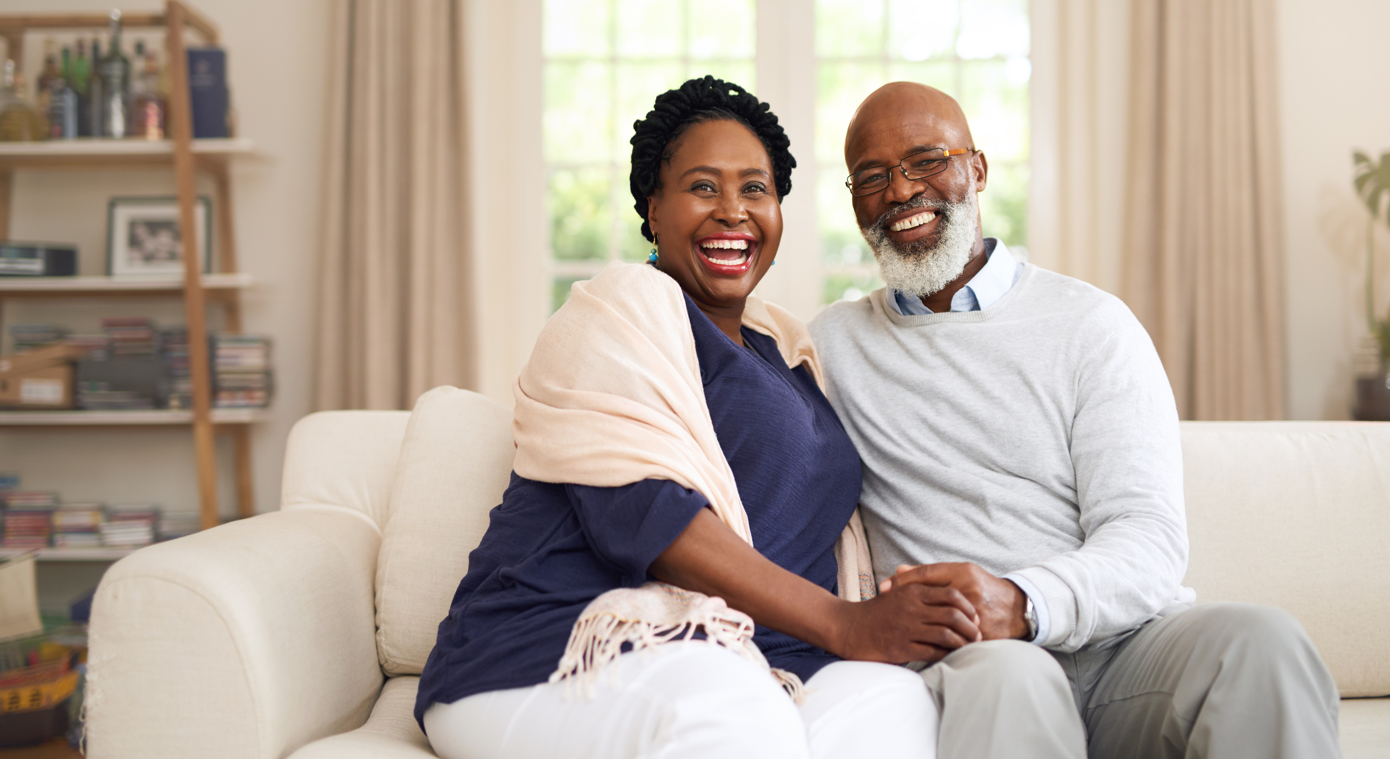 Happy Man and his wife with sitting in the living room
